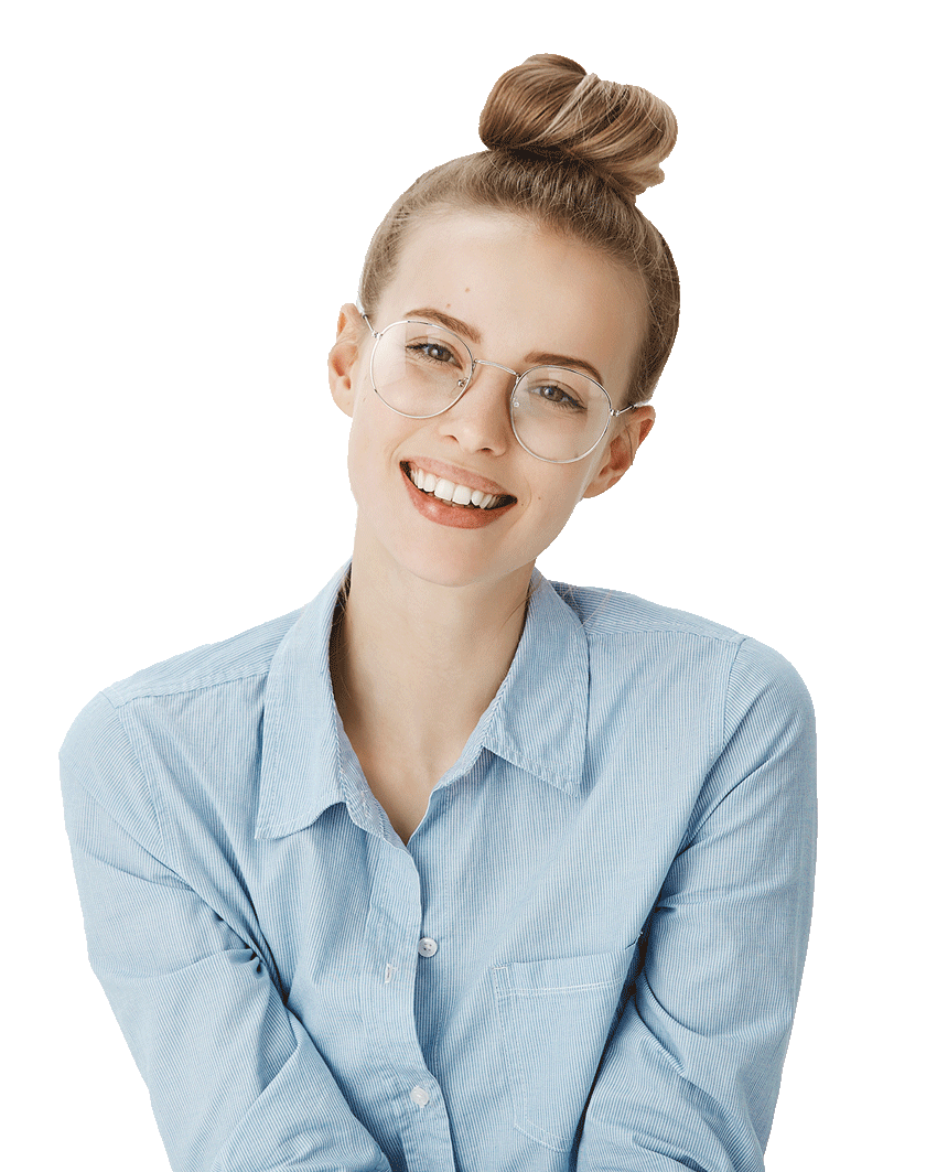 Smiling woman in glasses and a light blue shirt with hair in a bun, sitting against a white background.