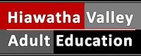 Logo with Hiawatha Valley Adult Education in white text on red, gray, and black background blocks.